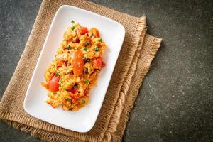 Stir-fried tomatoes with egg or Scrambled eggs with tomatoes photo