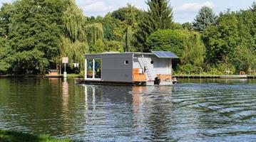 with the houseboat on the river Dahme in Brandenburg. relaxed sailing with the boat. photo