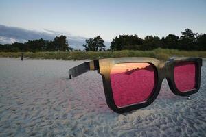 Sunglasses as photo motif on the beach of the Baltic Sea in Zingst.