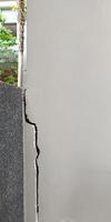 Cracked concrete building or cement wall broken at the outside effect with earthquake photo