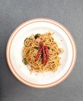 Spicy spaghetti pork. Drunken Spaghetti Thai call Popular in street food photo