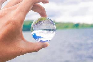 lens crystal ball photography of Buyan Lake view Bali premium photo