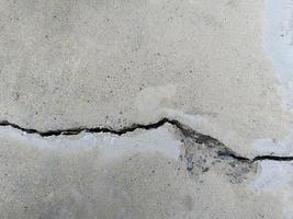 Cracked concrete building or floor cement wall broken at the outside effect with earthquake photo