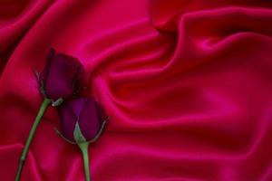 Red roses on a red cloth photo