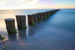 groynes jutting into the sea. taken in zingst on the darss. photo