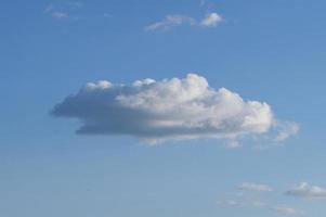 Clouds illuminated by the sun in the sky as background photo