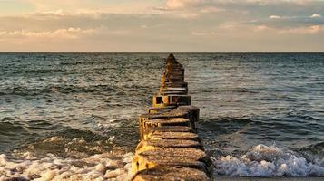 the Baltic Sea through the sea to the horizon at sunset. Romantic mood photo