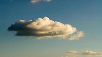 Clouds illuminated by the sun in the sky as background photo