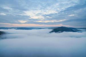 Fog rising on the mountains of the small Saar loop photo