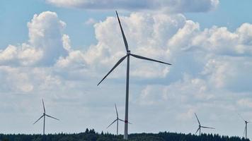 Windmill in foggy landscape. Renewable energy for environmentally conscious future. photo