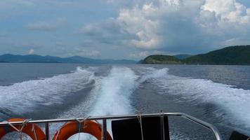 View from the rear of moving speedboat, slow motion video