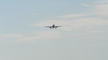 Jet passenger airliner extended landing gear and is approaching landing. Airplane landing in the background video