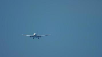 Widebody airplane approaching over ocean before landing in Phuket airport video