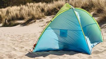 a tent for wind protection on the beach of the Baltic Sea in summer vacation photo