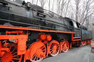 Steam locomotive parked at a terminal station. Historical railroad from 1940 photo