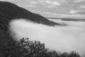 Fog rising on the mountains of the small Saar loop photo