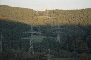 High voltage overhead power lines distributed across the country photo