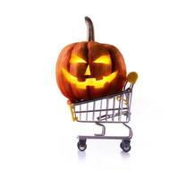 Halloween pumpkins in shopping cart isolated on white background photo