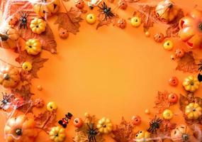 Halloween decoration on orange color background top view with copy space photo