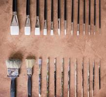 Paint brush on old parchment paper vintage aged or texture background photo