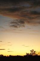 Clouds illuminated by the sun in the sky as background photo