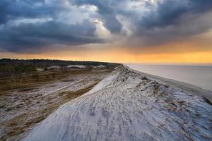 Dramatic sunset at the high dune on the darss. Beach, Baltic Sea, sky and sea. photo