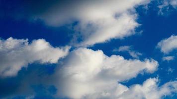 Clouds illuminated by the sun in the sky as background photo