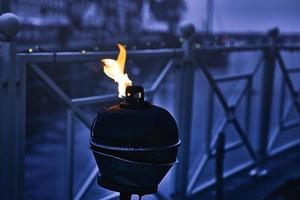 Burning oil lamp by the water in relaxed mood in Blavand photo