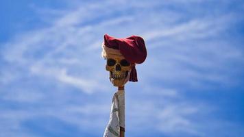 skull on a stick with cap. Taken at a medieval festival. Eerily beautiful photo
