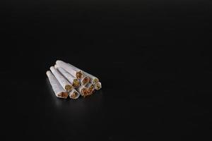 mountain of joints on a black background photo