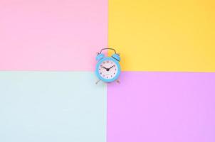 Time to choose metaphor concept. Alarm clock at the crossroads of different colors photo