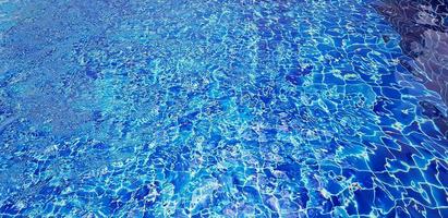 Art of swimming pool background. Abstract wave on water and reflection wallpaper. photo