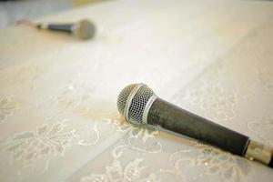 An unique concept of two microphone on table. photo