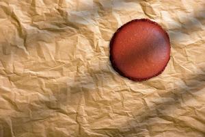 Close up of Christmas gingerbread cookie on brown paper background. photo