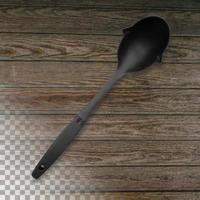 Black silicone chef's spatula on a transparent wooden background. photo