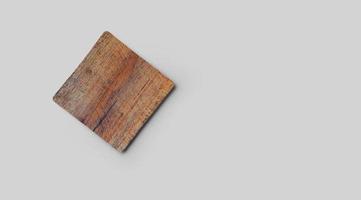 Empty square cork coaster, isolated on grey background. Perfect as food display. photo