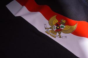 Gresik, indonesia, 2022 - garuda logo and red and white on cloth photo