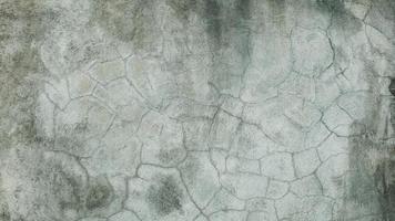 The old cement wall was weathered, the surface was scratched, the surface was scratched and damaged. For a mysterious retro-conservative background. photo