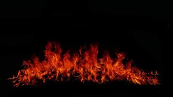 Flame Flame Texture For Strange Shape Fire Background Flame meat that is burned from the stove or from cooking. danger feeling abstract black background Suitable for banners or advertisements. photo