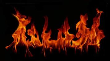 Flame Flame Texture For Strange Shape Fire Background Flame meat that is burned from the stove or from cooking. danger feeling abstract black background Suitable for banners or advertisements. photo