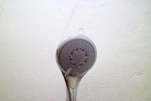 The end of the shower head is rounded for bathing photo