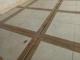 dirty brown tile floor in the yard photo