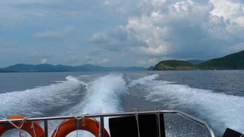 View from the rear of moving speedboat, slow motion video