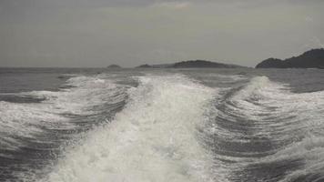 View from the rear of moving speedboat, slow motion video