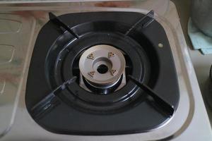 black square placemats on the gas stove photo