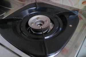 black square placemats on the gas stove photo