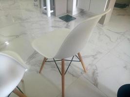 modern white chair on marble floor photo