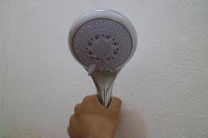 The end of the shower head is rounded for bathing photo