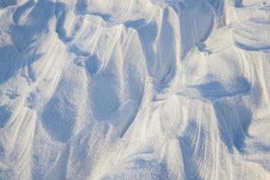 Snowdrifts, a field in winter photo