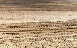 brown plowed  soil photo